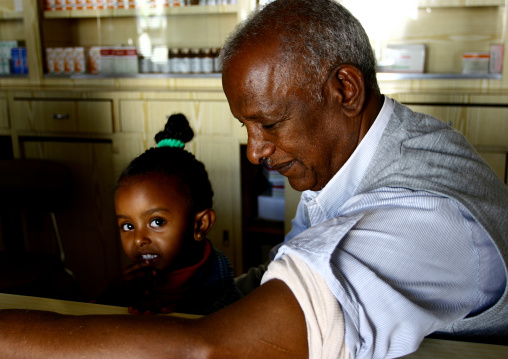 Father and daughter in a pharmacy, Central Region, Asmara, Eritrea