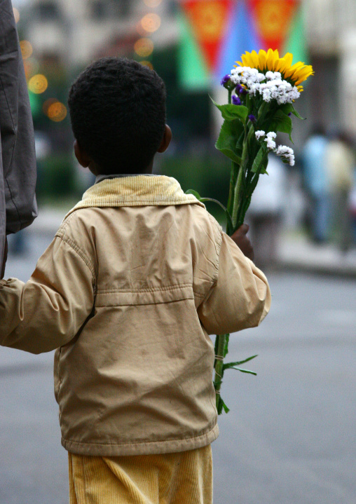 Eritrean boy with flowers on national day, Central Region, Asmara, Eritrea