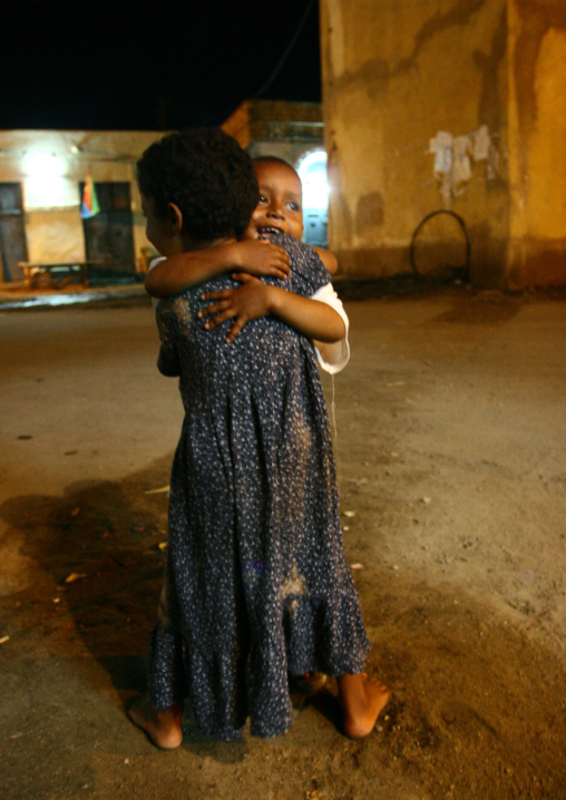 Eritrean children hugging in the street, Northern Red Sea, Massawa, Eritrea