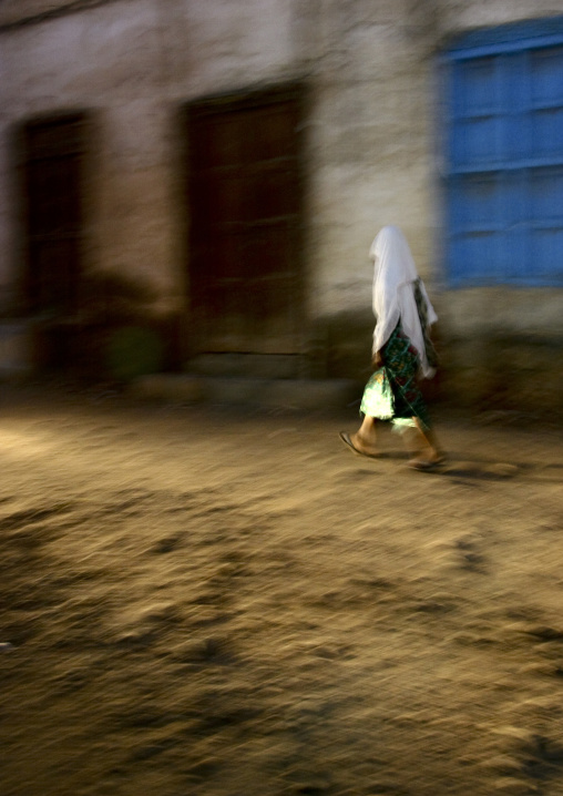 Veiled girl in the street at night, Northern Red Sea, Massawa, Eritrea