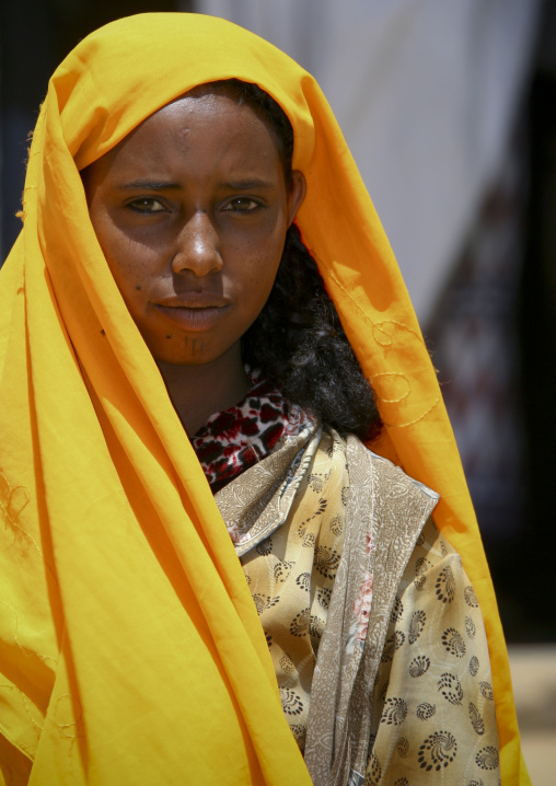 Eritrean teenage girl with a yellow veil, Debub, Senafe, Eritrea