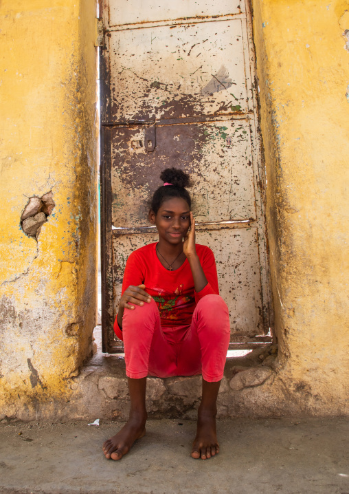 Eritrean girl sit in front of her house, Semien-Keih-Bahri, Keren, Eritrea