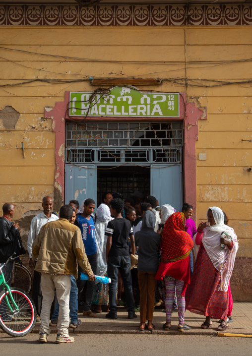 Eritrean people queueing in front of a butcher shop, Central region, Asmara, Eritrea