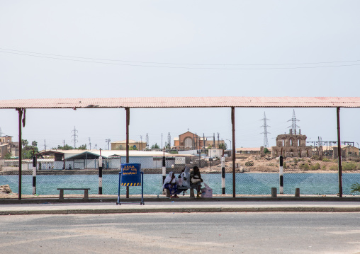 Eritrean women waiting for the bus under a shelter, Northern Red Sea, Massawa, Eritrea