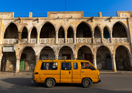 Taxi passing in front of an ottoman architecture building, Northern Red Sea, Massawa, Eritrea