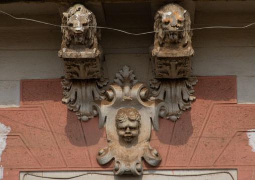 Lions and angel statues from the italian colonial era over a doorway, Central region, Asmara, Eritrea