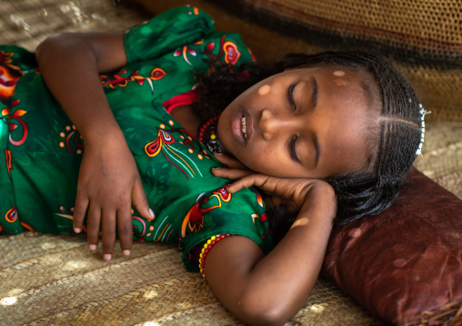 Eritrean girl sleeping on a leather pillow, Central region, Asmara, Eritrea