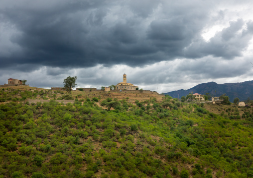 Church against storm clouds in the highlands, Debub, Embatkalla, Eritrea