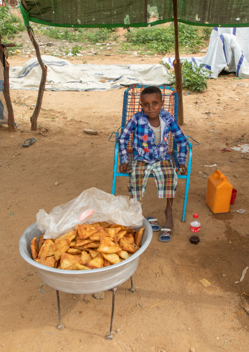 Eritrean boy selling samoussas, Debub, Ghinda, Eritrea