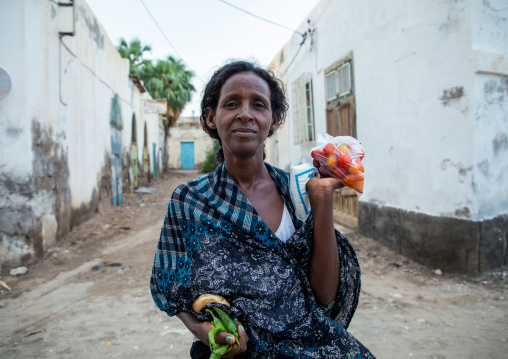 Portrait of an eritrean woman coming back from the market in the street, Northern Red Sea, Massawa, Eritrea