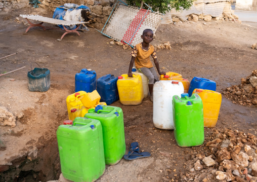 Eritrean boy collecting water in the town, Northern Red Sea, Massawa, Eritrea