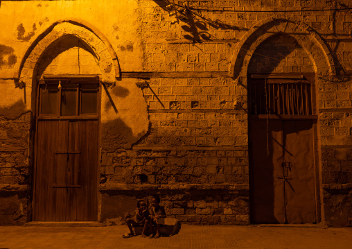 Eritrean children in front of an old ottoman house at night, Northern Red Sea, Massawa, Eritrea