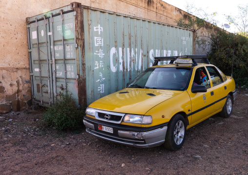 Eritrean taxi parked near a chinese container, Central Region, Asmara, Eritrea