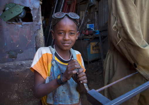 Child working at medebar metal market, Central Region, Asmara, Eritrea
