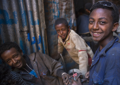 Eritrean children working in medebar metal market, Central Region, Asmara, Eritrea