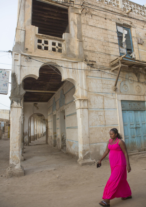 Eritrean women passing near an old ottoman building, Northern Red Sea, Massawa, Eritrea