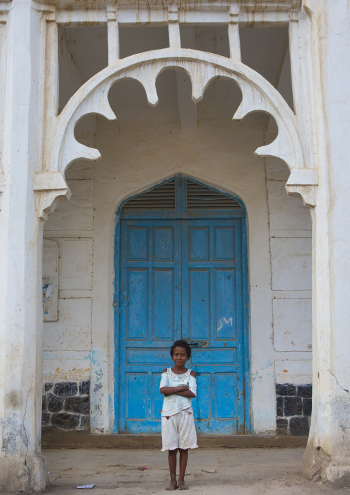 Eritrean child standing in front of an ottoman house, Northern Red Sea, Massawa, Eritrea