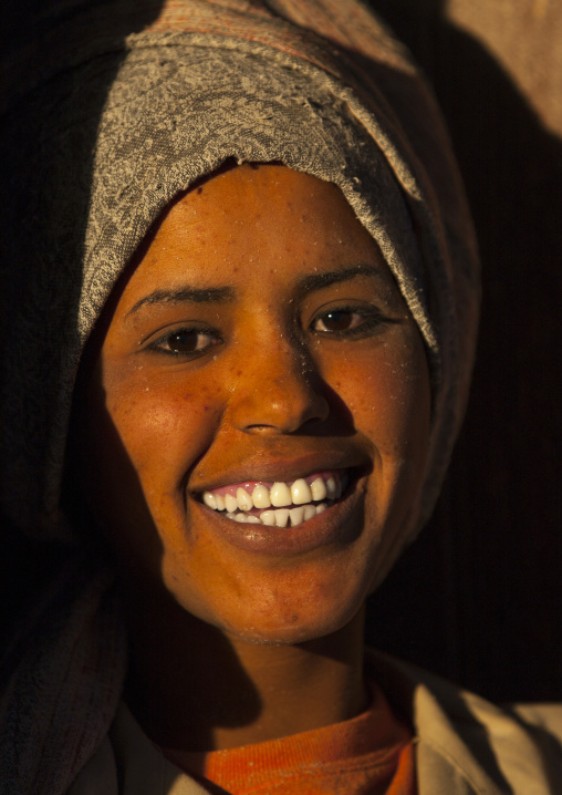 Smiling eritrean woman standing in a door, Central Region, Asmara, Eritrea