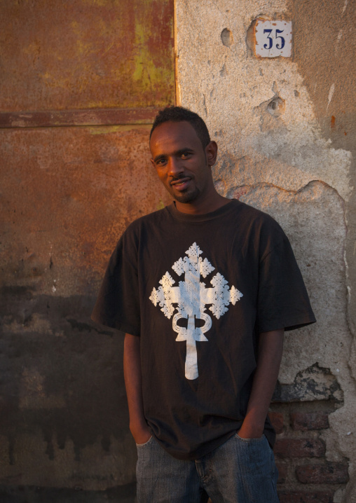 Portrait of an eritrean man wearing a tshirt with an orthodox cross, Central Region, Asmara, Eritrea