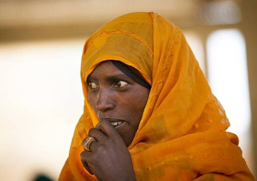 Portrait of an eritrean woman with yellow scarf, Debub, Adi Keyh, Eritrea