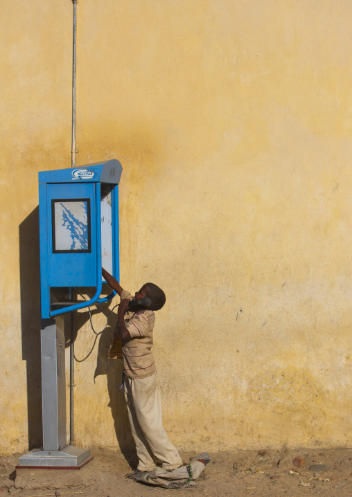 Eritrean boy using a public phone, Anseba, Keren, Eritrea