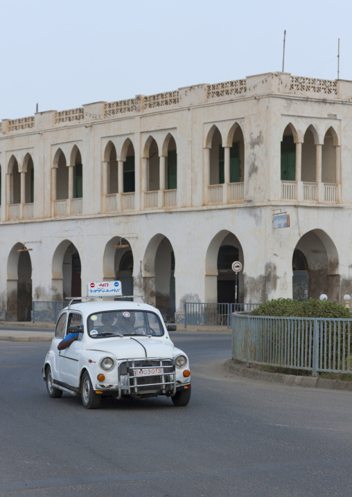 Fiat car from a driving school in front of an ottoman building, Northern Red Sea, Massawa, Eritrea