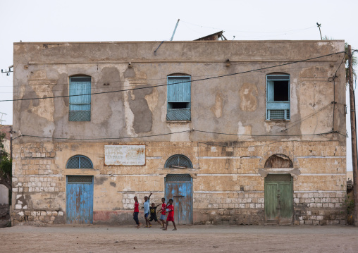 Eritrean children playing in front of an old ottoman house, Northern Red Sea, Massawa, Eritrea