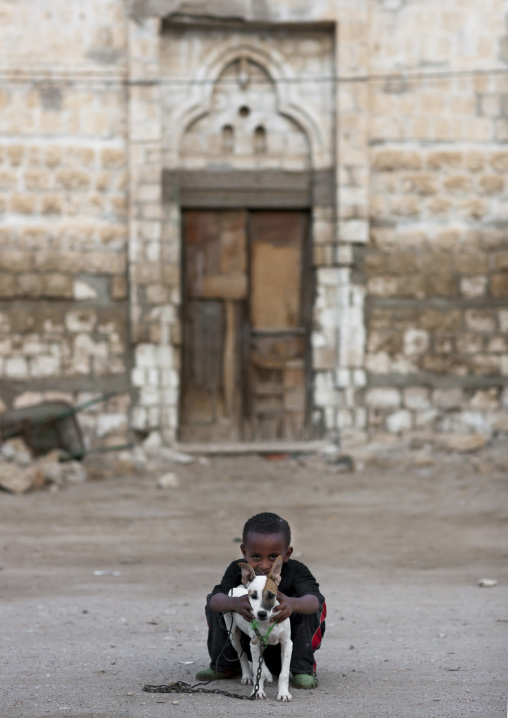 Eritrean boy with his dog, Northern Red Sea, Massawa, Eritrea