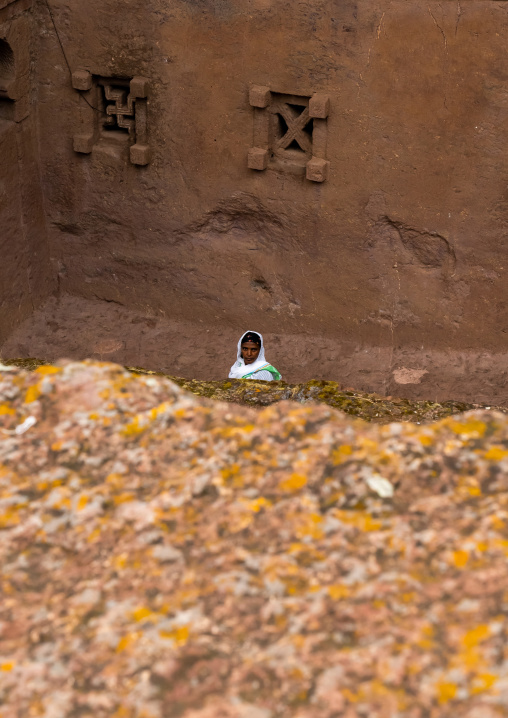 Ethiopian woman pilgrim in a rock-hewn church, Amhara Region, Lalibela, Ethiopia