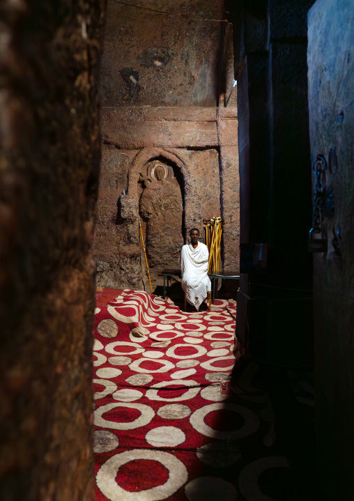 Ethiopian monk inside a rock-hewn church, Amhara Region, Lalibela, Ethiopia