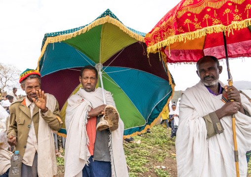 Ethiopian men under umbrellas during a celebration in Bilbaia Giorgis, Amhara Region, Lalibela, Ethiopia