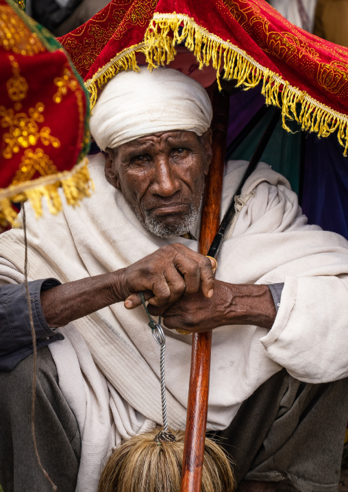Ethiopian man under an umbrella during a celebration in Bilbaia Giorgis, Amhara Region, Lalibela, Ethiopia