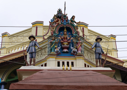 Goddess Lakshmi flanked by elephants and British soldiers on a house, Tamil Nadu, Athangudi, India