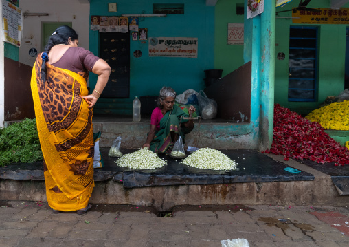 Indian woman selling flowers in a market, Tamil Nadu, Madurai, India