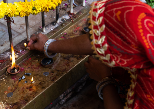 Indian women making offerings in Galtaji temple, Rajasthan, Jaipur, India
