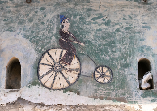 Old mural in a haveli depicting a man riding a bicycle, Rajasthan, Ramgarh Shekhawati, India