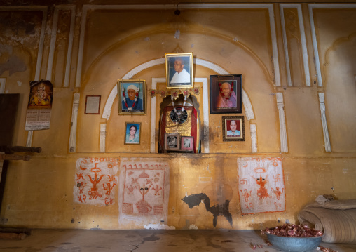 Family pictures hanging on the wall of the fort, Rajasthan, BIssau, India