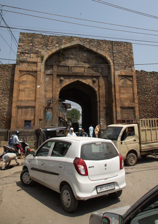 Cars in front of Mughal arched gate in old city wall, Jammu and Kashmir, Srinagar, India
