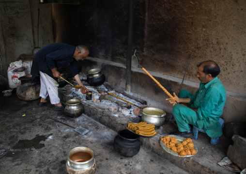 Kashmiri men preparing kebabs in a kitchen, Jammu and Kashmir, Srinagar, India