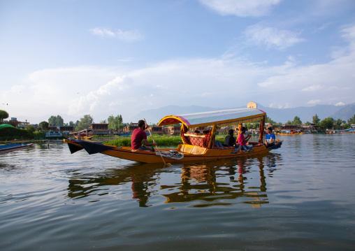 Shikara boat with tourists on Dal lake, Jammu and Kashmir, Srinagar, India