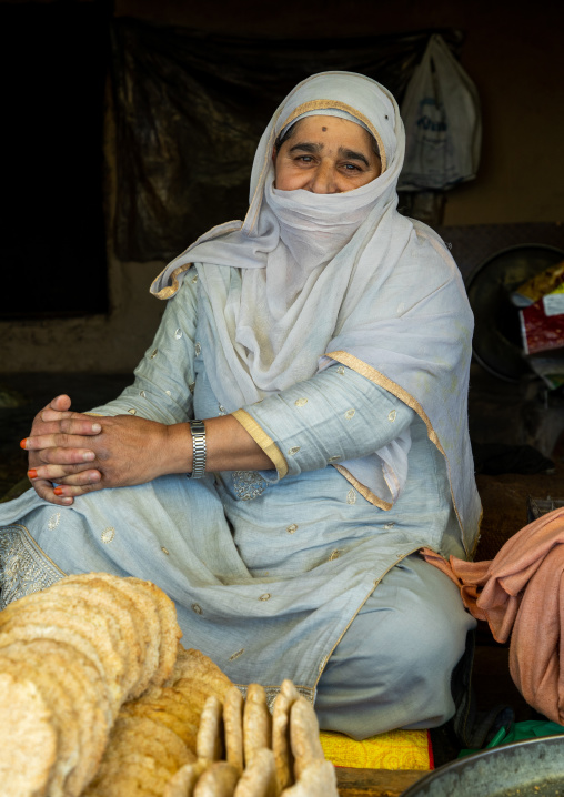 Kashmiri woman selling bread, Jammu and Kashmir, Charar- E- Shrief, India
