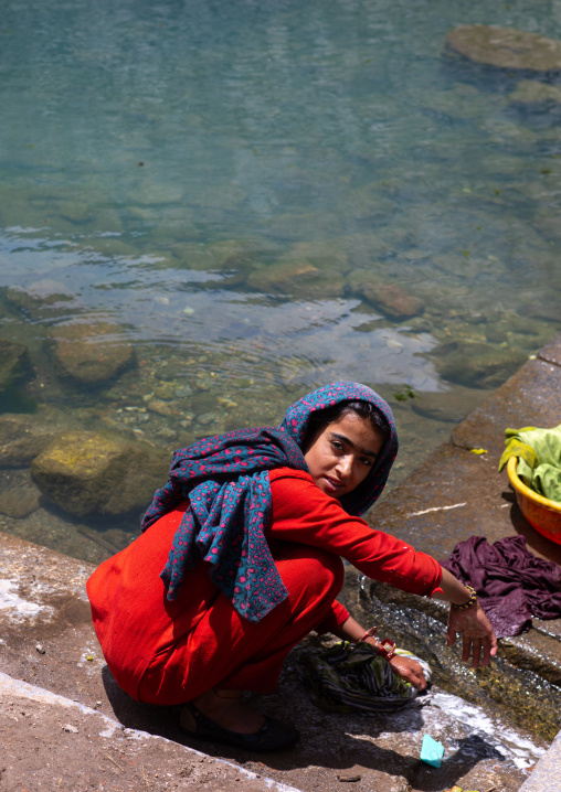 Indian woman washing clothes in a pond, Jammu and Kashmir, Kangan, India