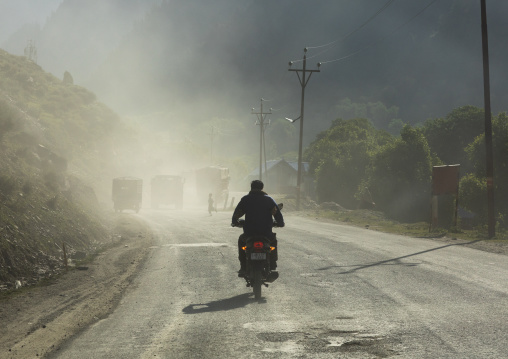 Motorbike on a dusty road, Jammu and Kashmir, Sonamarg, India