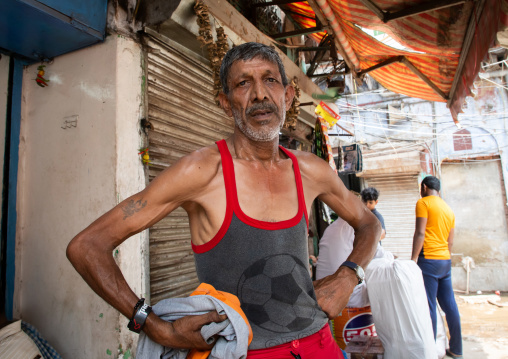 Portrait of a tired indian worker in old Delhi, Delhi, New Delhi, India