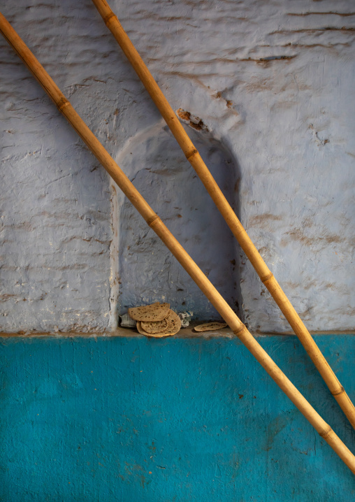 Bamboo sticks in front of a niche in old Delhi, Delhi, New Delhi, India