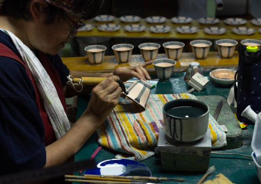 Artisans working in Genemongama porcelain atelier, Kyushu region, Arita, Japan