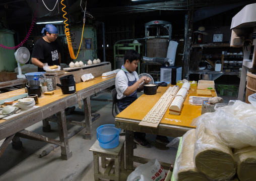 Artisans working in Genemongama porcelain atelier, Kyushu region, Arita, Japan