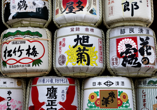 Large traditional sake barrels stacked up outside Kushida-jinja, Kyushu region, Fukuoka, Japan