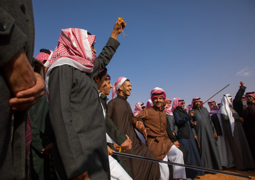 Saudi men dancing during King Abdul Aziz Camel Festival, Riyadh Province, Rimah, Saudi Arabia