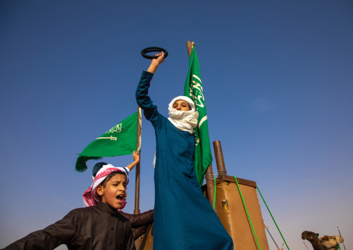 Saudi children dancing during King Abdul Aziz Camel Festival, Riyadh Province, Rimah, Saudi Arabia